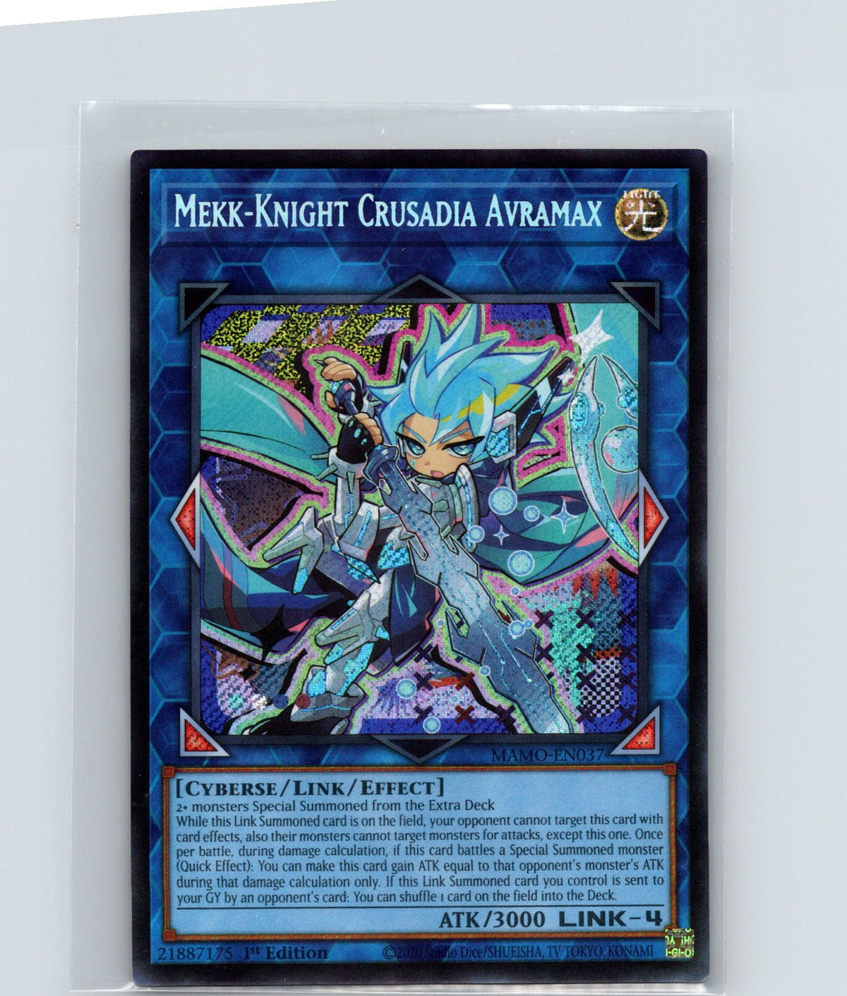A Yu-Gi-Oh! trading card of 'Mekk-Knight Crusadia Avramax' in a protective plastic sleeve, photographed against a light gray background.